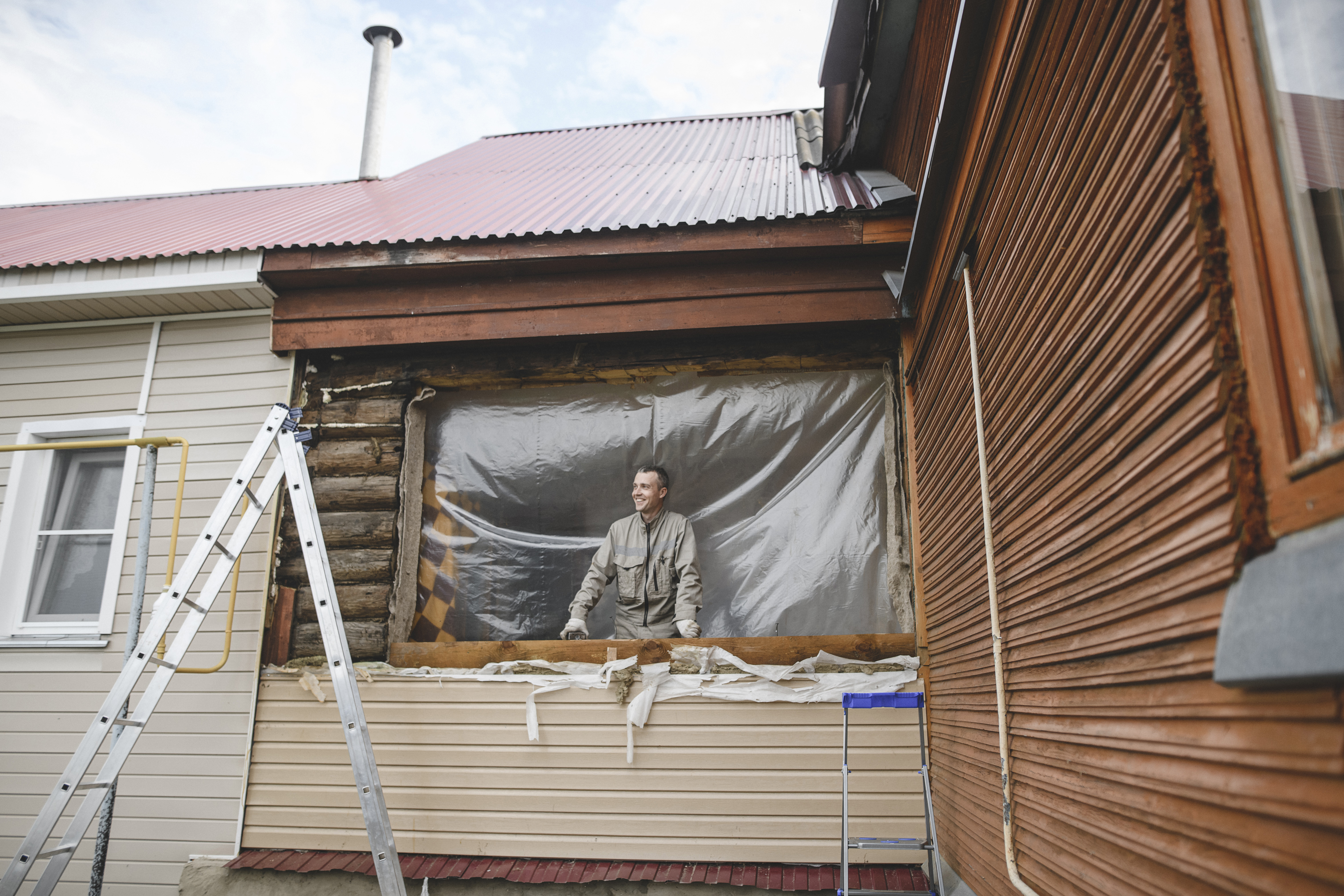man repairing the windows of his house 2022 12 16 22 43 09 utc Tea Circle