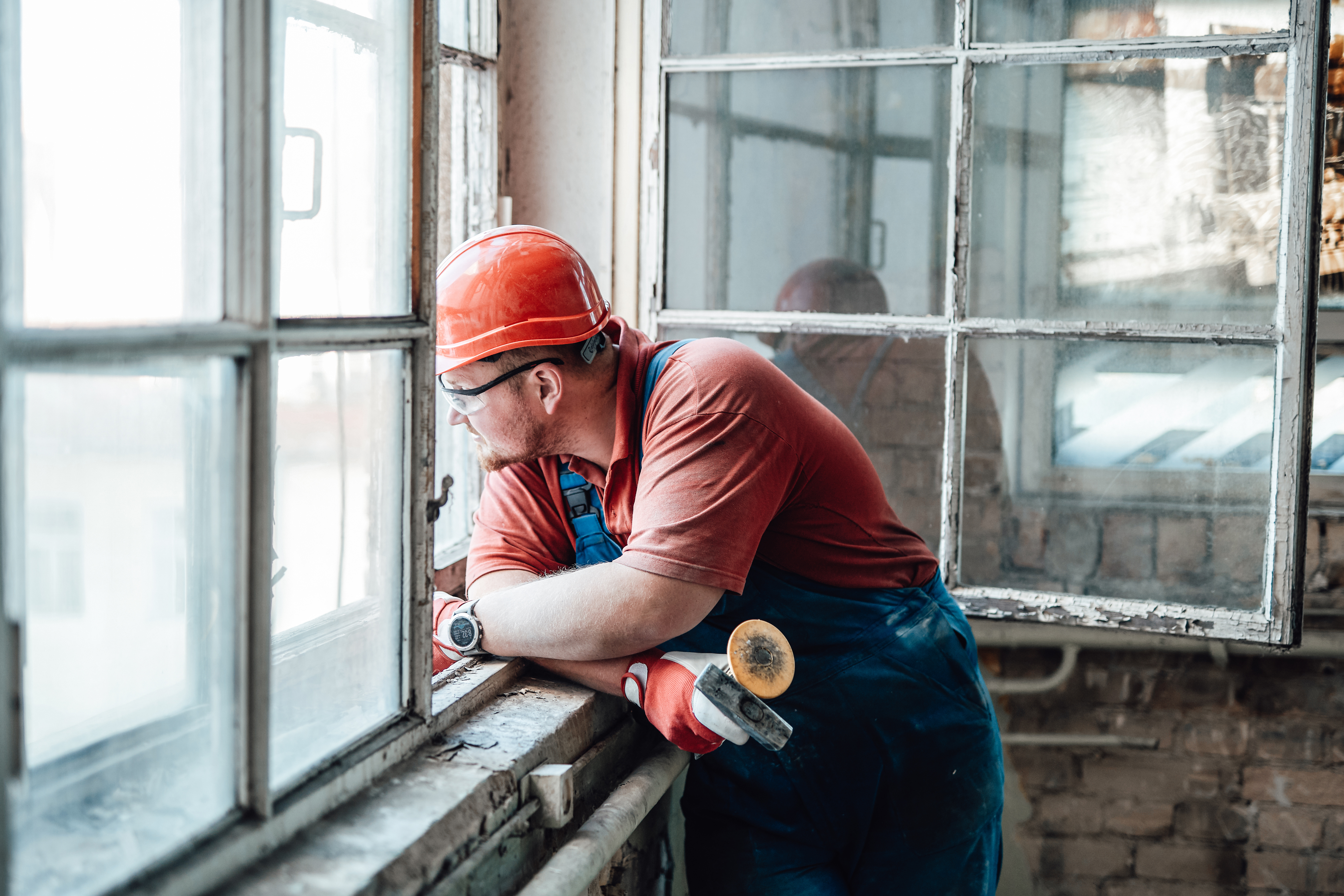 tired-worker-looks-out-of-the-window-202